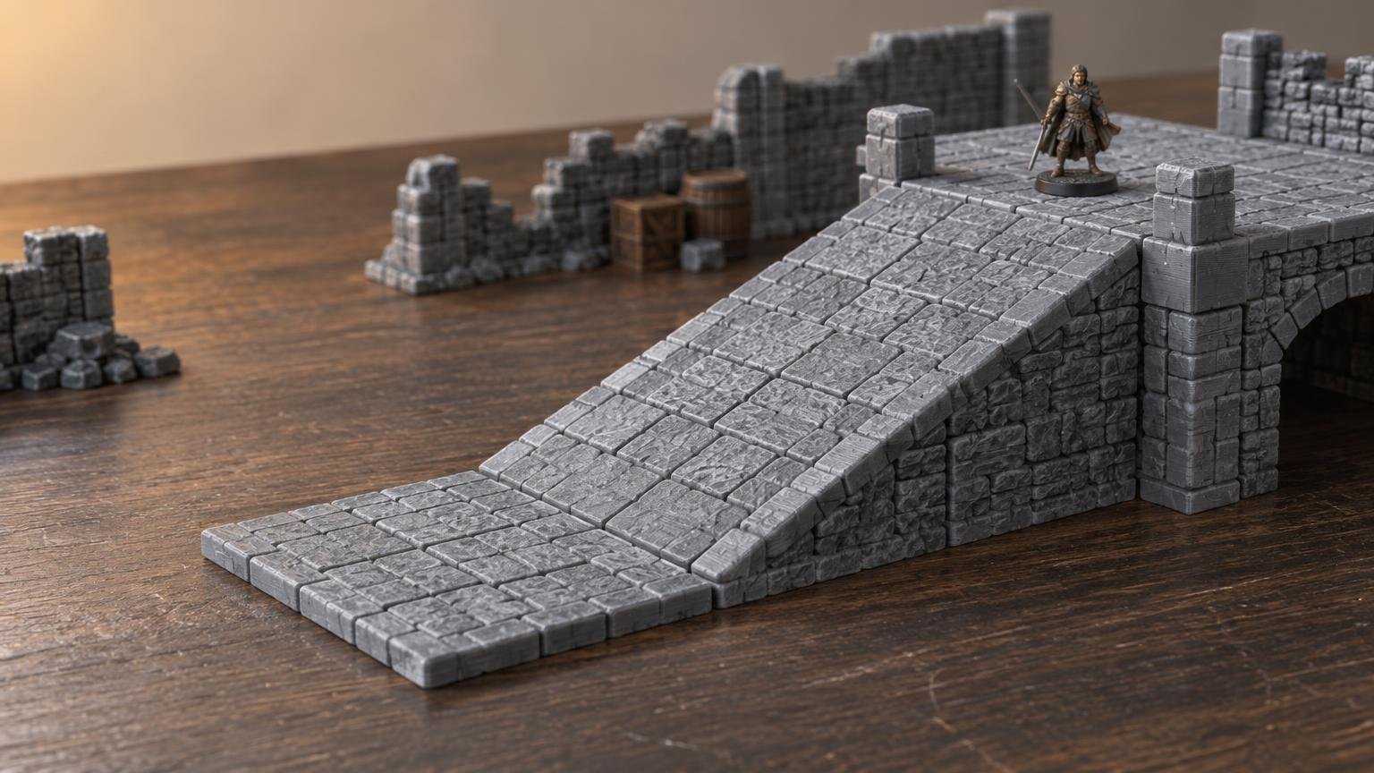 Gray FDM-printed stone terrain ramp with a broad tiled base rising to a raised platform, flanked by ruined walls and a small fantasy miniature on a wooden tabletop.
